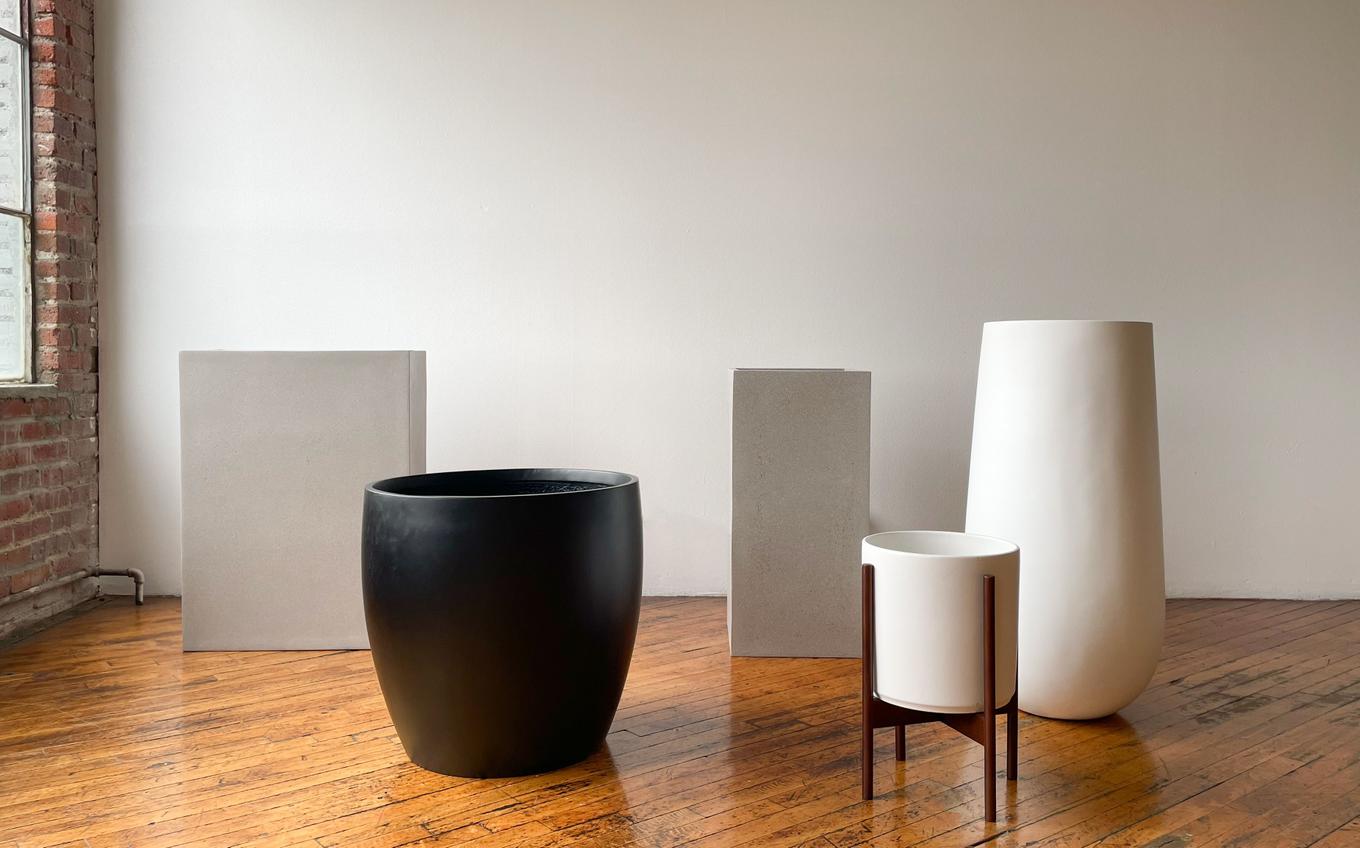 An assembly of architectural, modern planters, professional grade for both indoor and outdoor use.